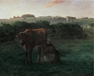 Mujer ordeñando una vaca